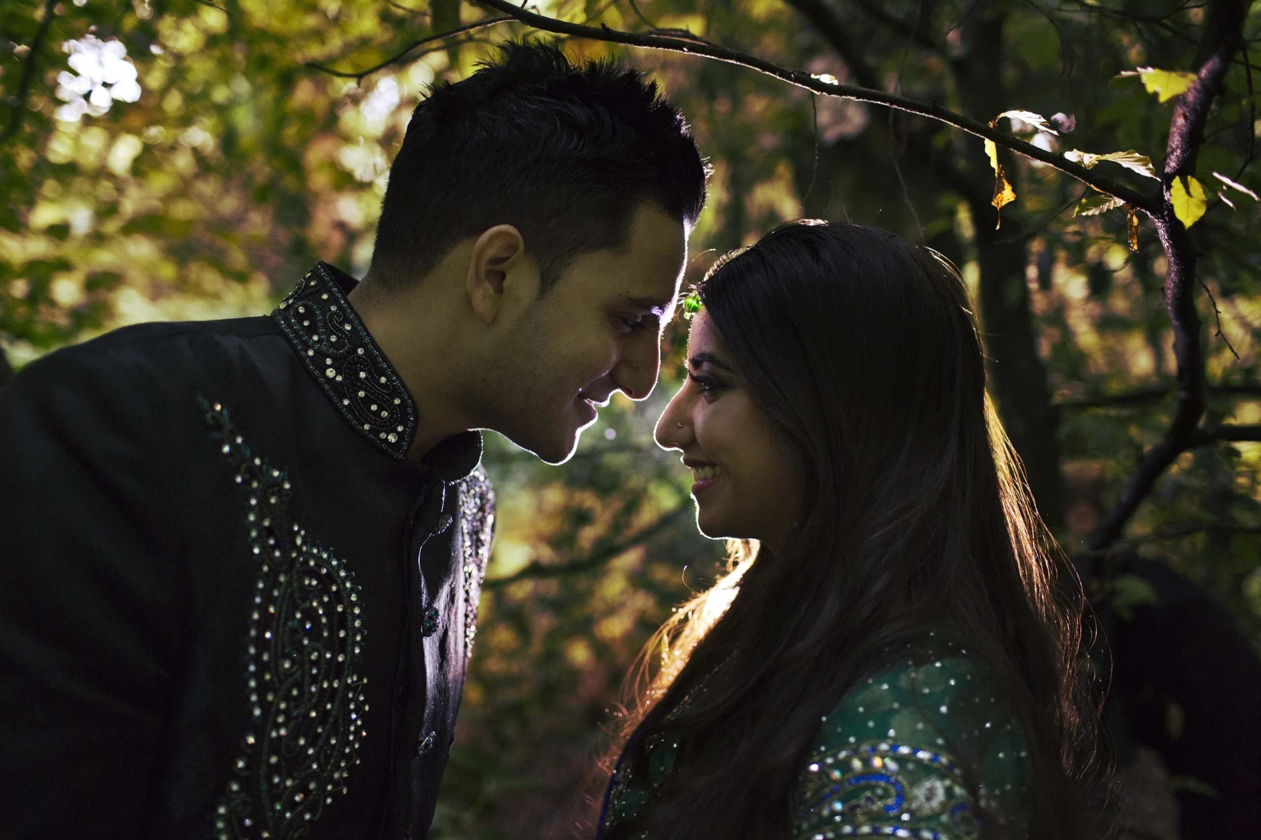 Couple foreheads touching in soft evening light